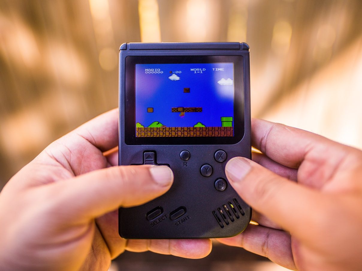 Shallow Focus Photo of Gameboy Console
