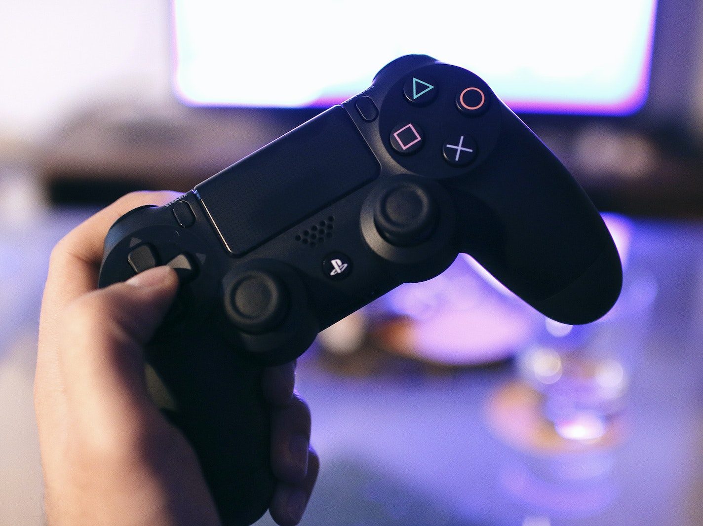 Person Holding Sony Ps4 Dualshock 4