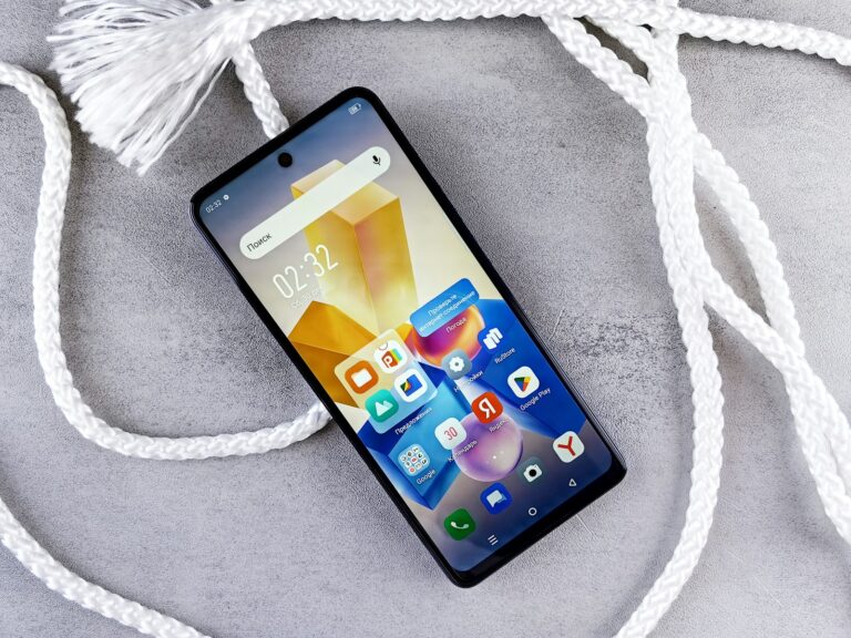 a close up of a cell phone on a rope